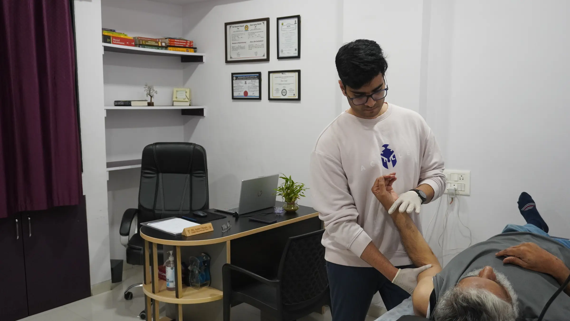 Physiotherapist assessing a patient's lower leg